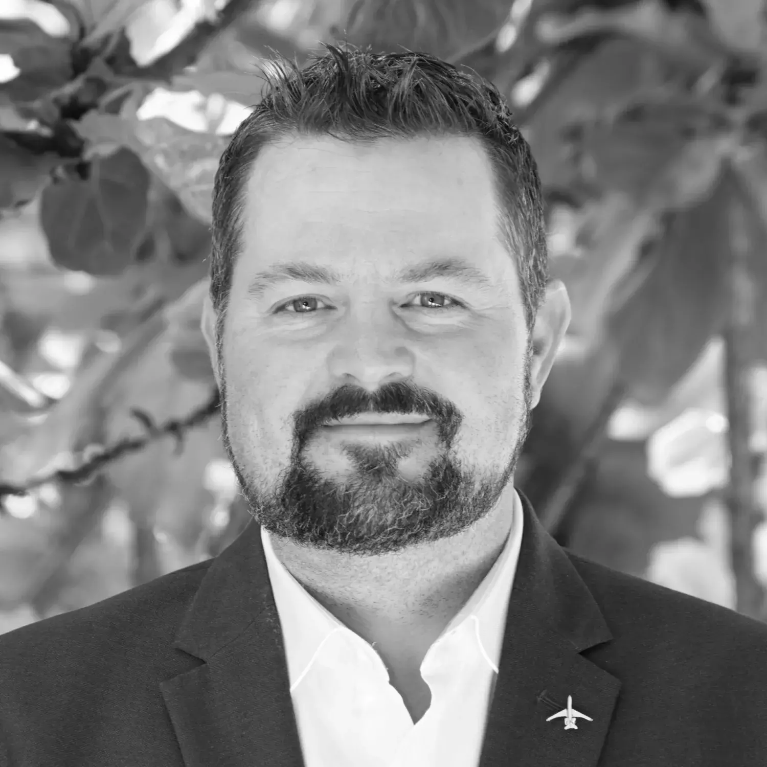 Black and white headshot of Chris Brenner