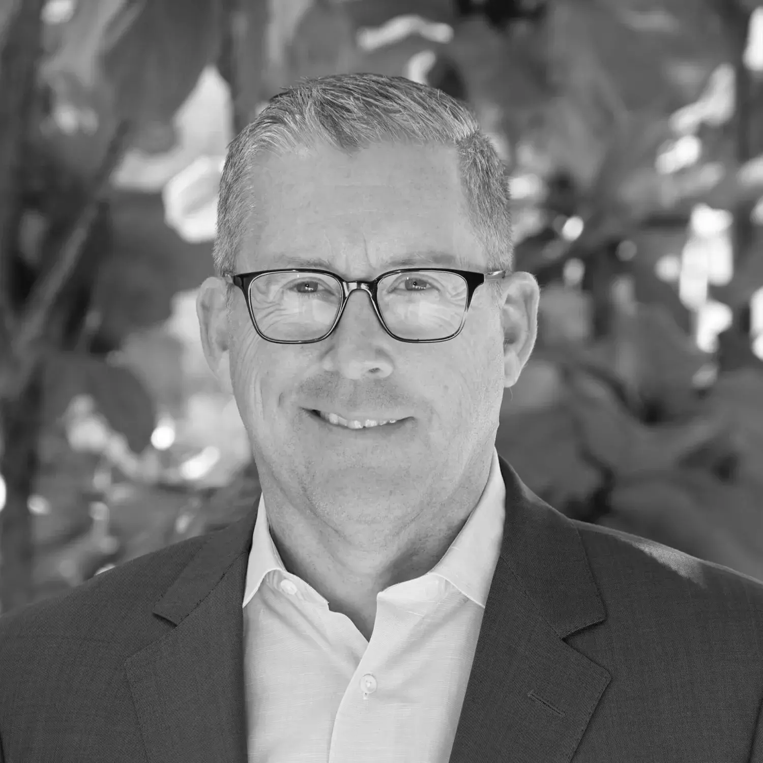 Black and white headshot of John Odegard