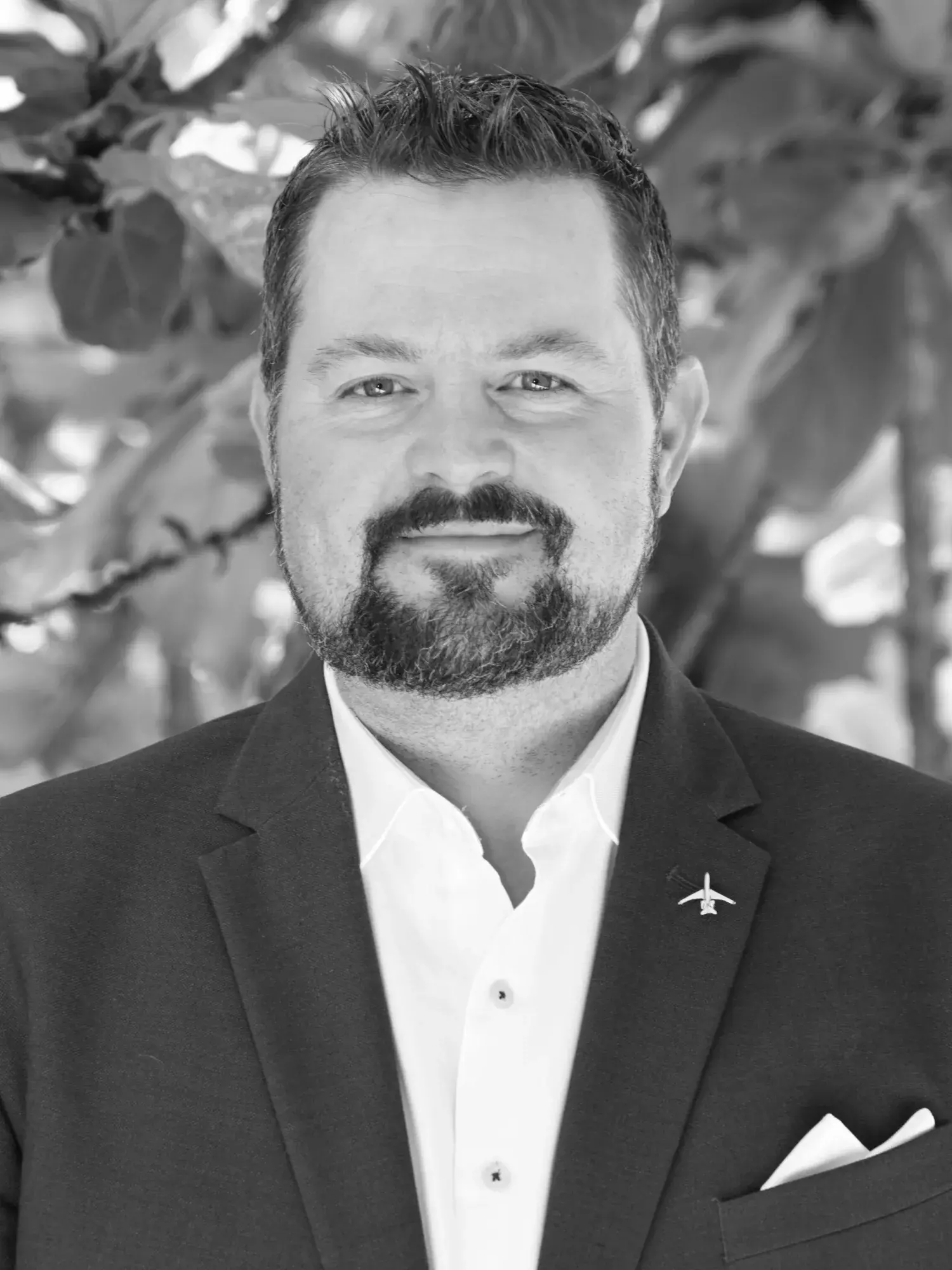 Black and white headshot of Chris Brenner