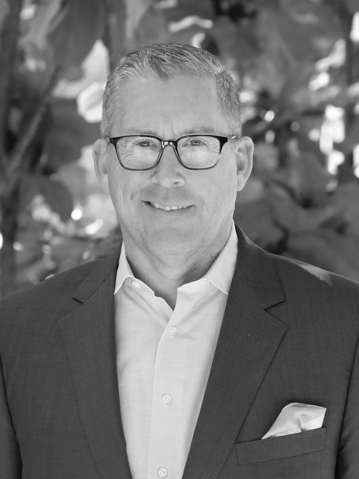 Black and white headshot of John Odegard